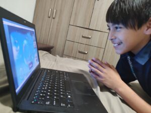 Happy child engaged in Fluentz Kidz learning